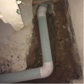 Drain tile being installed in a basement in Elmhurst, Illinois