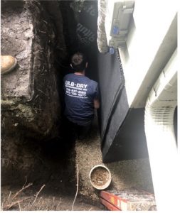 Basement waterproofing membrane installation in West Chicago, Illinois